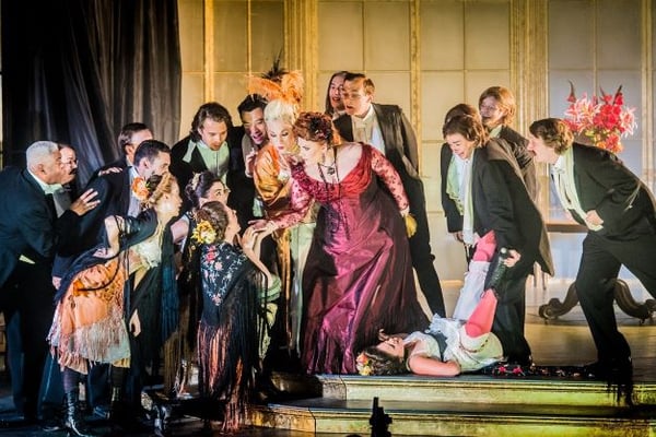 Performers onstage in La Traviata at Opera Holland Park