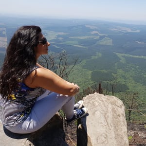 Harpal sits on a cliff, lost in nature