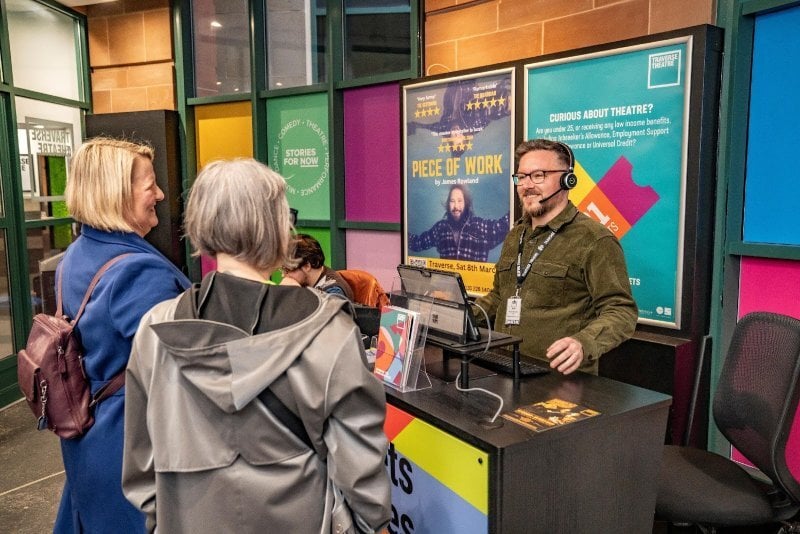 The new lobby of the Traverse Theatre in Edinburgh, Scotland, where friendly interactions take place between customers and staff.