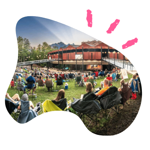 Audiences on the lawn awaiting a performance at Saratoga Performing Arts Center