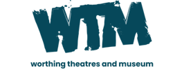 WTM: Worthing Theatres and Museum logo, designed to resemble a dark blue ink stamp.