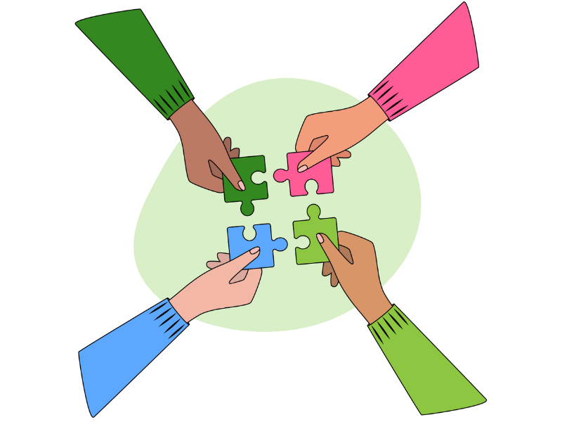 Four different hands each holding a puzzle piece which all fit together in the middle