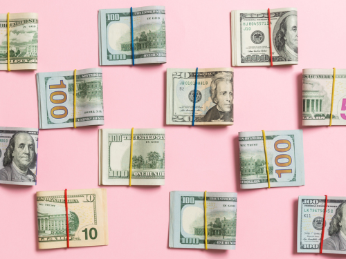 an image of american paper money piled together