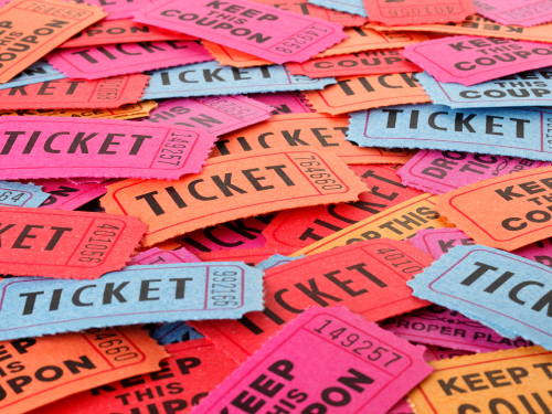 an image of colorful tickets piled together