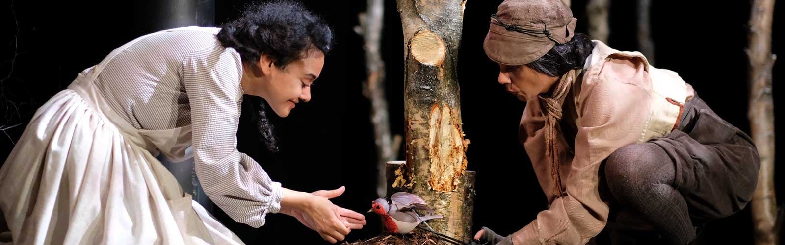 Actors care for a puppet robin redbreast onstage at Theatre by the Lake, 2021, photo by Steve Barber