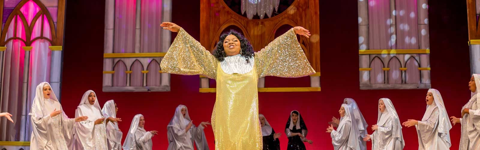 A singer performs in Sister Act at Performance Riverside