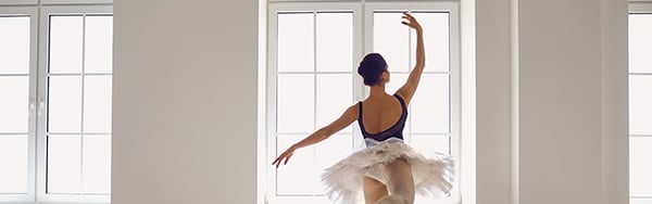 a ballerina dancing in a rehearsal room