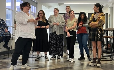 Members of the Spektrix team laughing together as they take part in a team activity. Alice Young, Rachael Norris, Niki Bierton, James Wood, Grace Plumb, Harpal Bhelt, Apoorva Singh