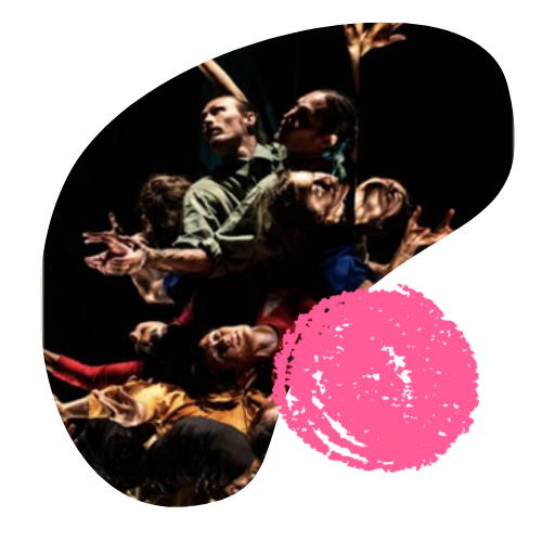 Dancers move in a tight group, wearing flowing costumes of gold, red, and green