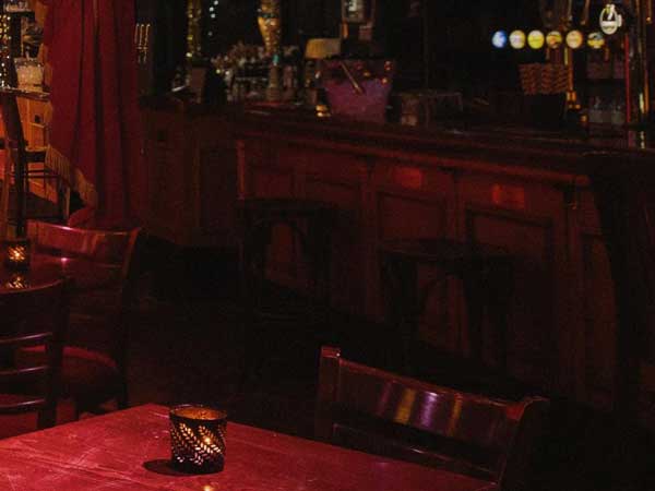 Empty table near the bar in a darkened Phoenix Arts Club