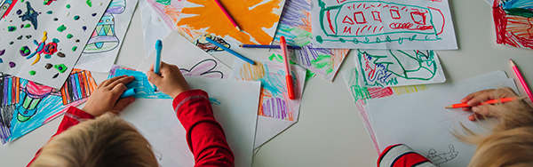 kids doodling on a table