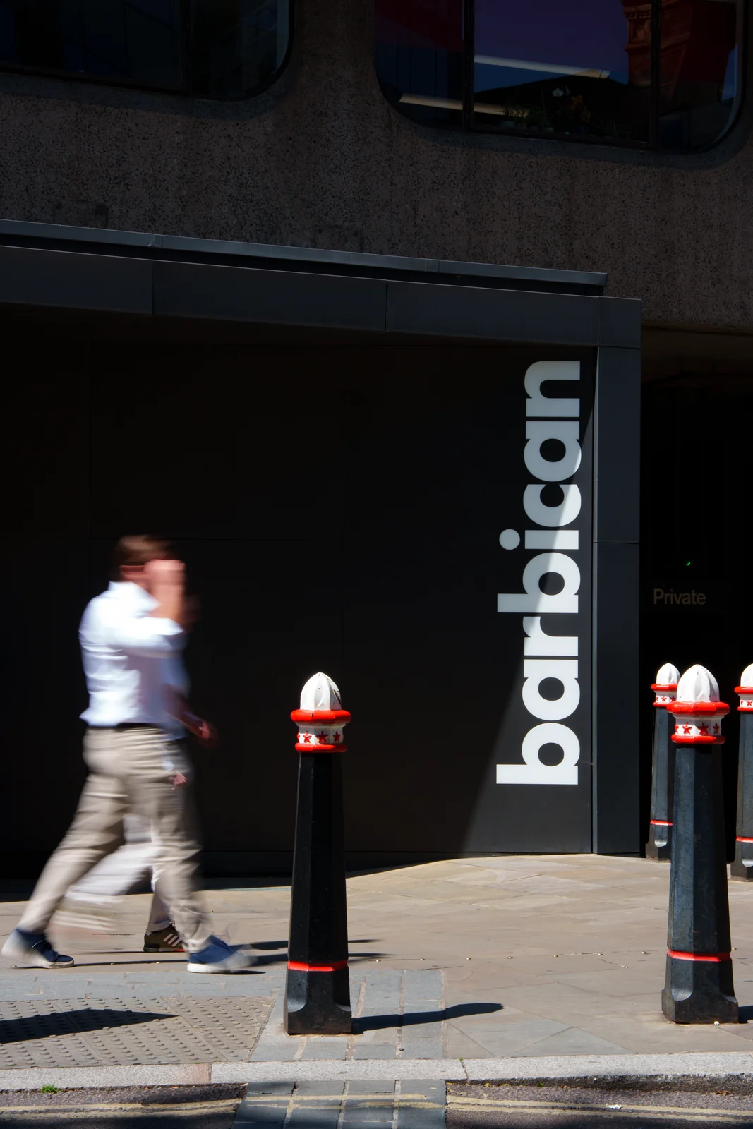 Barbican Exterior Vertical Sign With Pedestrian
