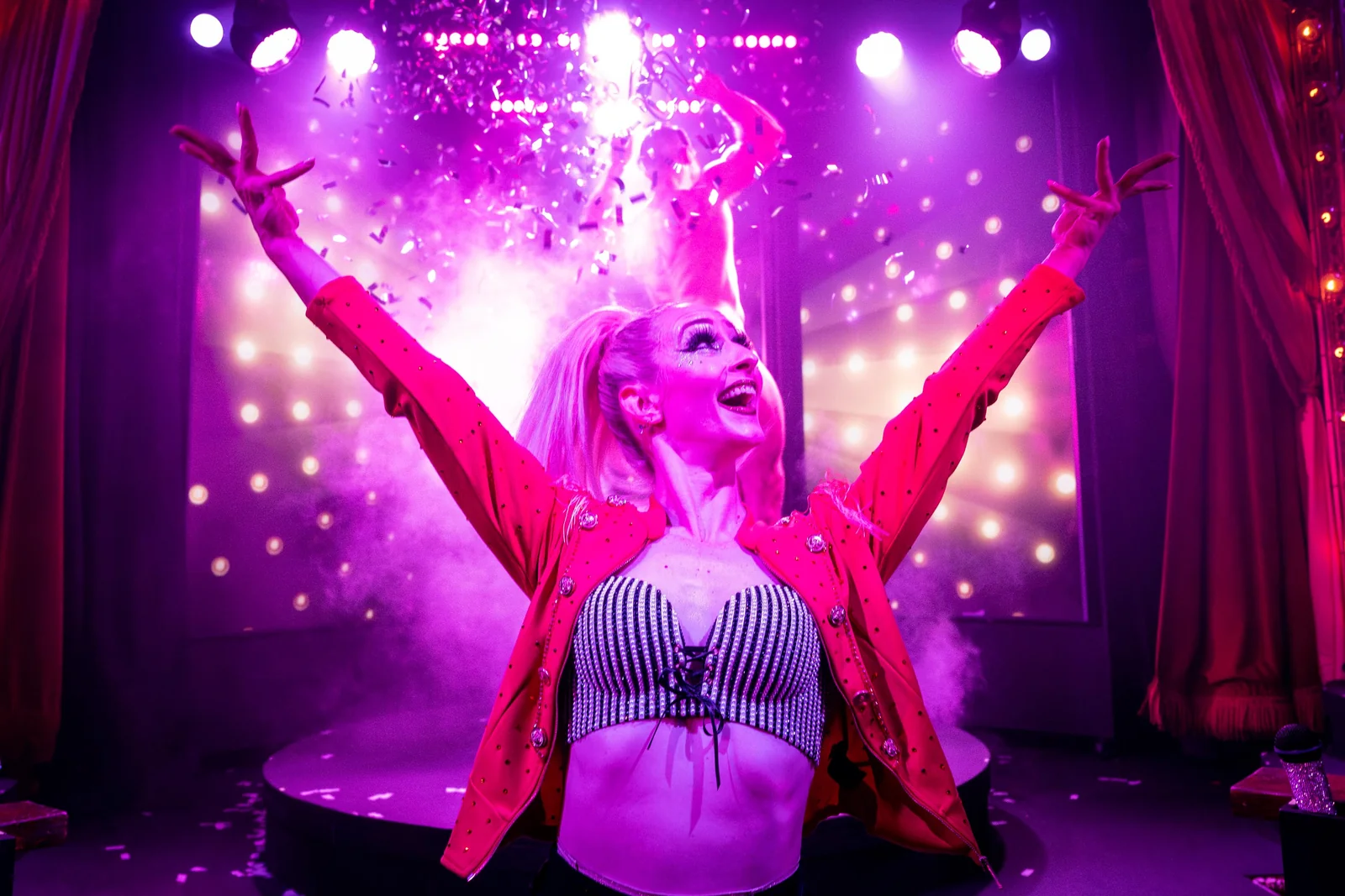 Can Can Culinary Cabaret Solo Dancer Finale Pink Stage Lighting