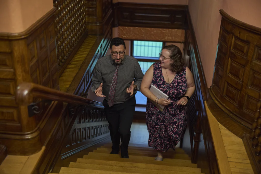 Cca Staff Walking Down Stairs